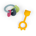 Blue beaded ring with pink, grey, and green bear charms next to a yellow bear-shaped silicone teether.