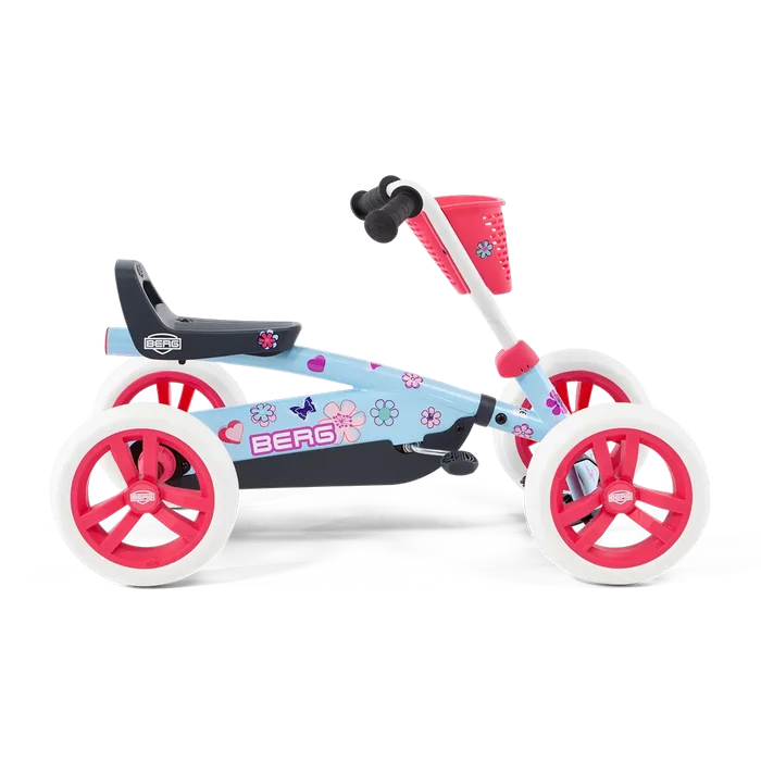 Light blue pedal kart with pink front basket, floral stickers, and pink wheels with white tires.