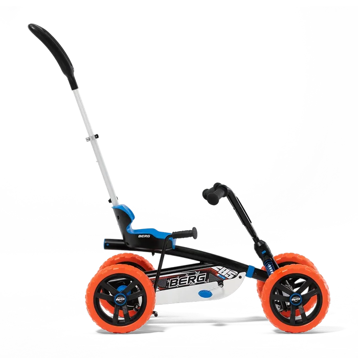 Pedal go-kart featuring a black frame, chunky orange tires, blue seat, and a tall silver parent push handle.