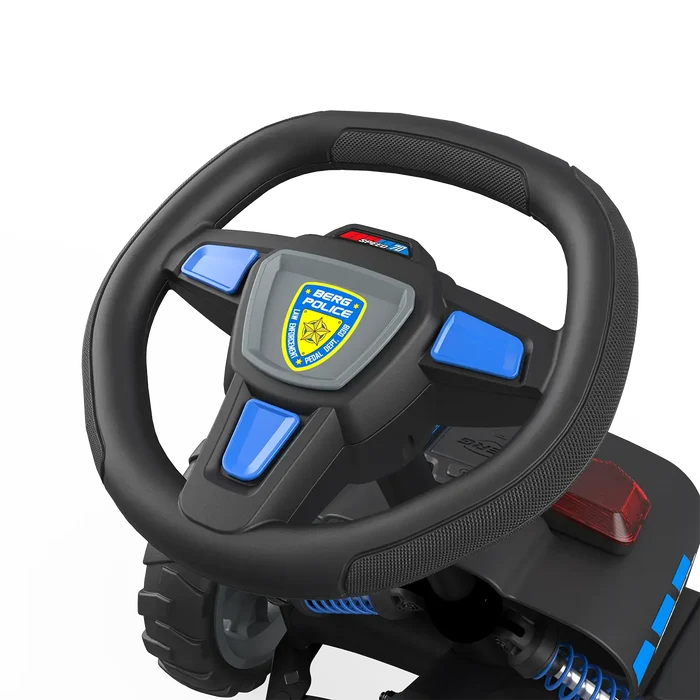Black textured toy steering wheel with blue buttons, a police badge, and blue suspension springs below.