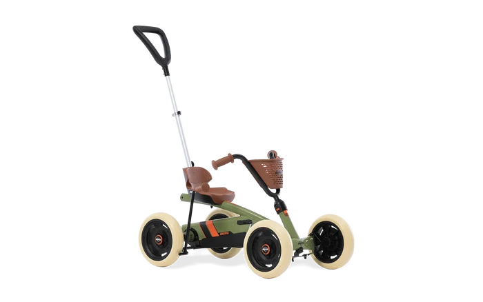Olive green kids' go-kart with cream tires, brown seat, basket, and a tall adjustable silver push handle.
