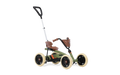 Olive green kids' go-kart with cream tires, brown seat, basket, and a tall adjustable silver push handle.
