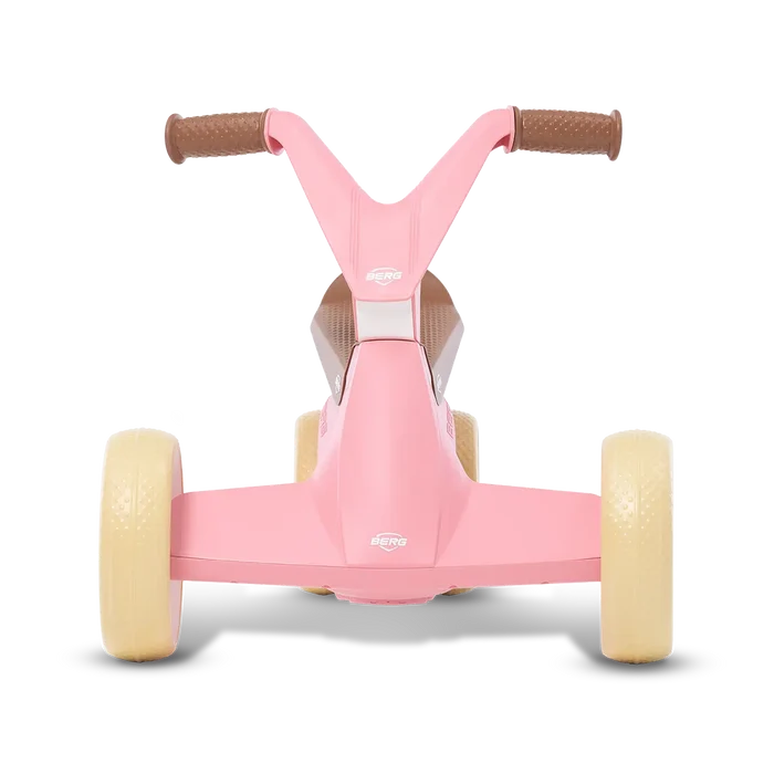 Rear view of a pink toddler ride-on toy with four cream wheels and brown textured handlebars.