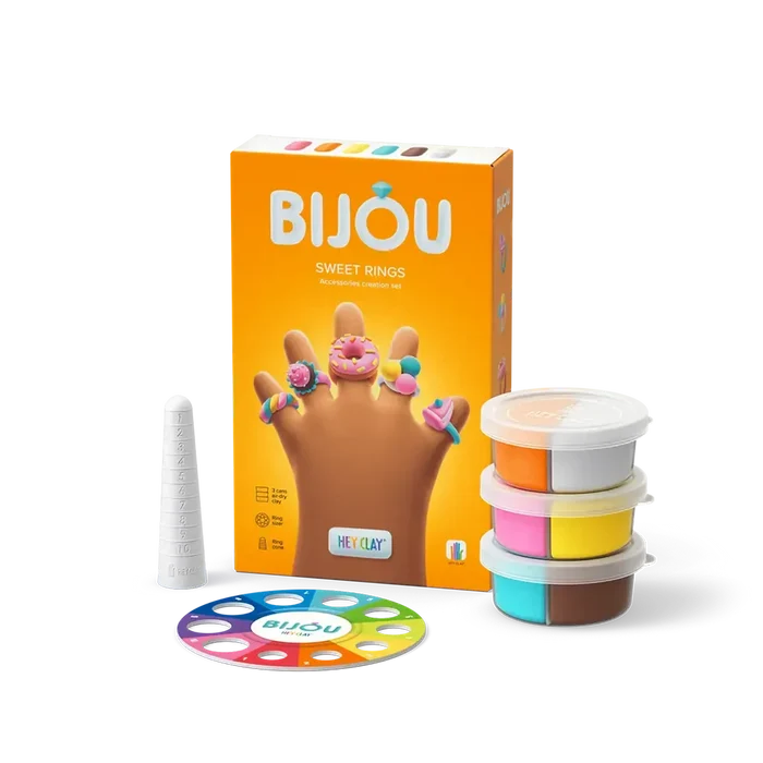 Orange box showing hand wearing clay rings, three multi-color clay tubs, a white ring cone, and a colorful ring sizer.