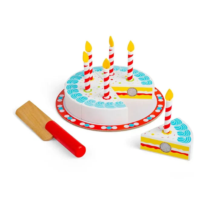 White wooden toy cake with blue icing, five red striped candles, a removable slice, and a wooden knife with a red handle.