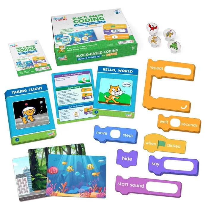 Coding kit featuring a green box, colorful coding blocks, character stands, scenery cards, and instructional guides.