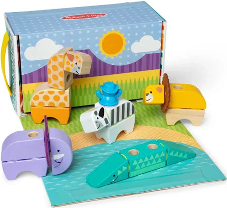 Modular toy safari animals in bright colors and patterns, arranged in front of a blue illustrated storage box.