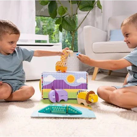 Two boys play with colorful wooden animal blocks including a giraffe, elephant, and lion next to a scenic storage box.