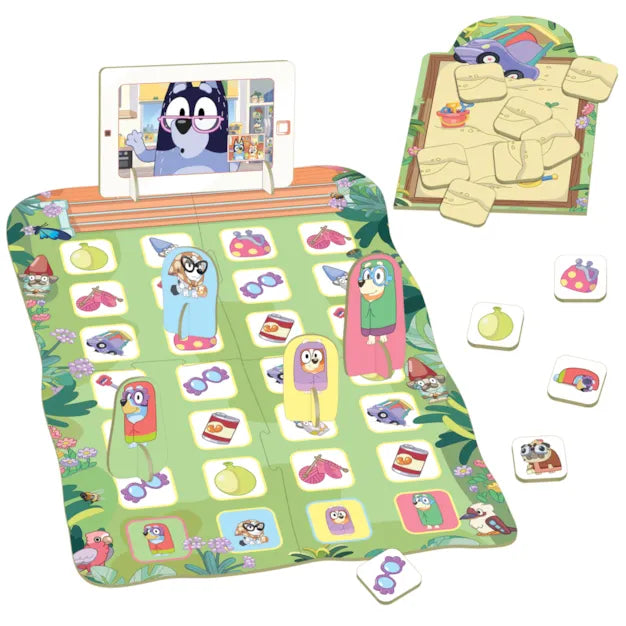 Colorful Bluey board game with granny-character standees, icon tiles, and a tablet display on a green grid mat.