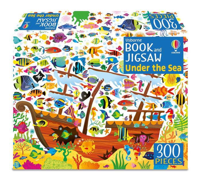 Colorful product box showing a sunken pirate ship and many bright, patterned tropical fish in a vibrant sea.