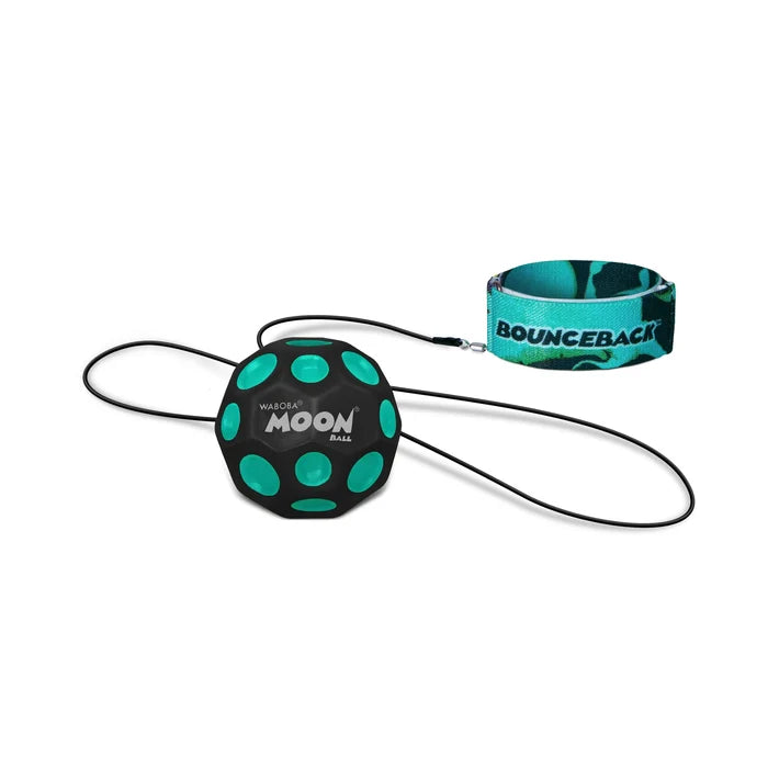 Black cratered ball with teal spots attached via elastic cord to a teal patterned wristband labeled Bounceback.