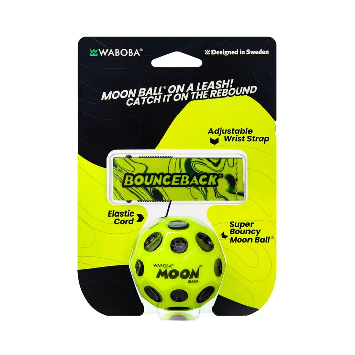 Neon yellow Moon Ball with black craters, attached by cord to a green marbled wrist strap in retail packaging.