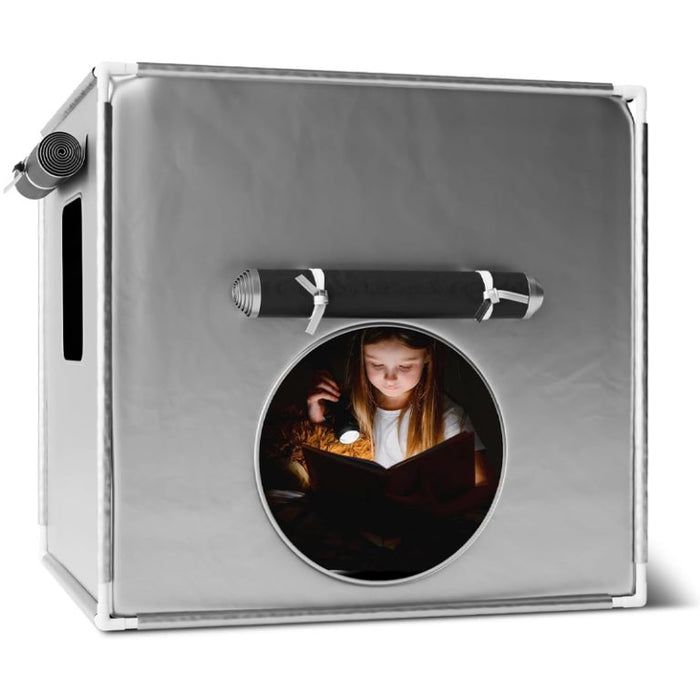 Square grey sensory tent with white frame and a circular window showing a girl reading a book with a flashlight.