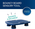 Textured blue rectangular board with side handles and four thick black legs for sensory bouncing and balance.