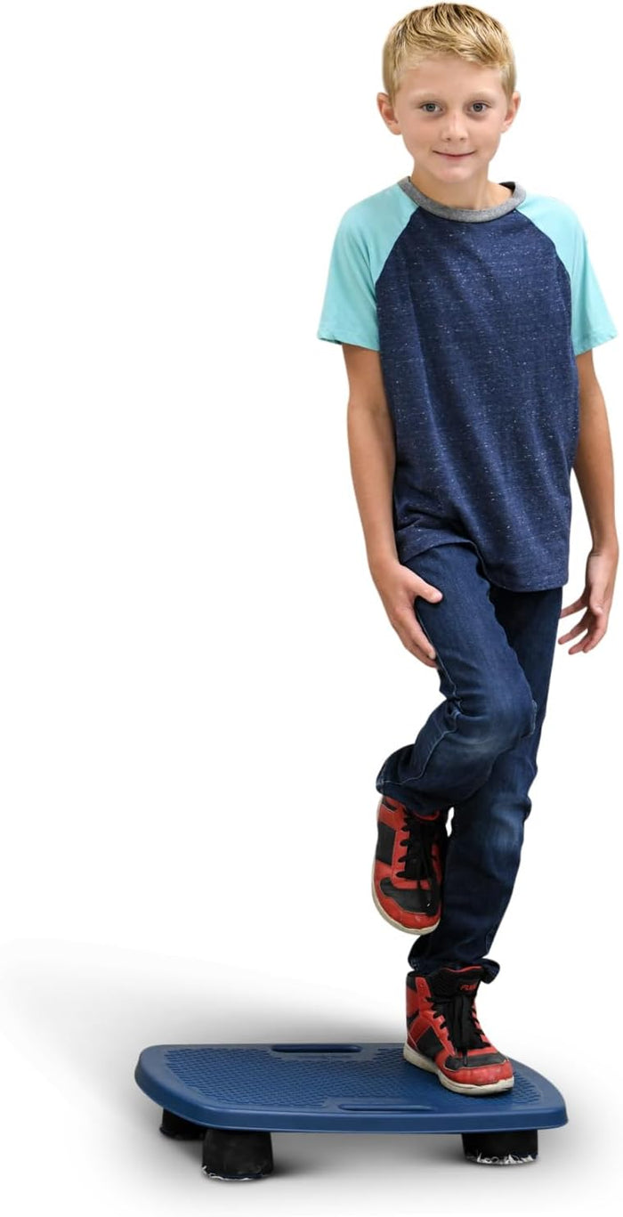 A child balances on one foot on a blue textured rectangular platform with four black rubber feet.