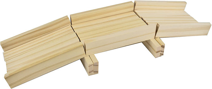 Model bridge built from natural light-colored wood planks, with three angled segments and two vertical support blocks.