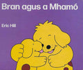Purple book cover featuring two yellow spotted dogs hugging, with white text Bran agus a Mhamó and Eric Hill.