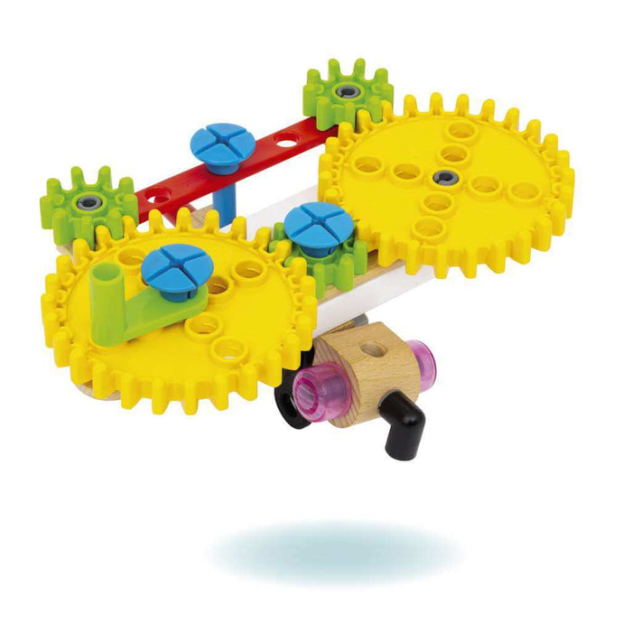 Toy construction model featuring interlocking yellow and green gears, blue screws, and red pieces on a wooden base.