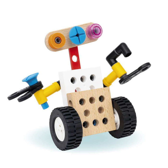Toy robot built with wooden blocks, yellow plastic arms, and large black wheels, featuring a three-eyed head.