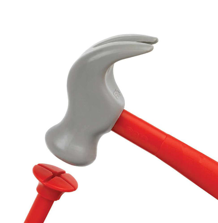 Close-up of a grey plastic toy hammer about to strike a red plastic nail with a cross-shaped head.