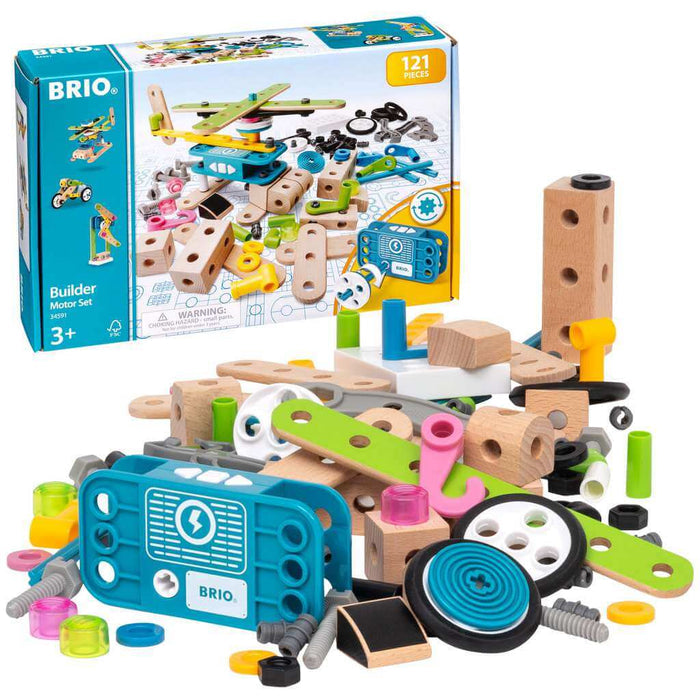 Blue box behind scattered wooden blocks, colorful plastic screws, wheels, and a blue battery-powered motor unit.