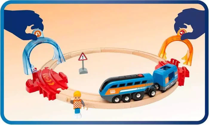 Blue toy train on a wooden circular track with colorful interactive arches, a worker figure, and a warning sign.