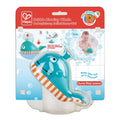 Teal toy whale with orange belly stripes and a bubble spout, displayed in red and white Hape branded bath toy packaging.