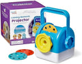 Blue and white toy projector with yellow knobs and handle next to purple box and red and teal projection discs.