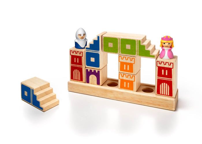 Wooden castle building blocks with stairs, a knight, and a princess arranged on a rectangular wooden base.