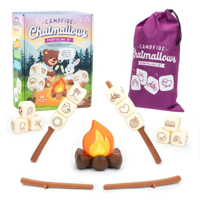 Toy campfire set with plastic flames, roasting sticks, cream marshmallow cubes with icons, purple bag, and retail box.