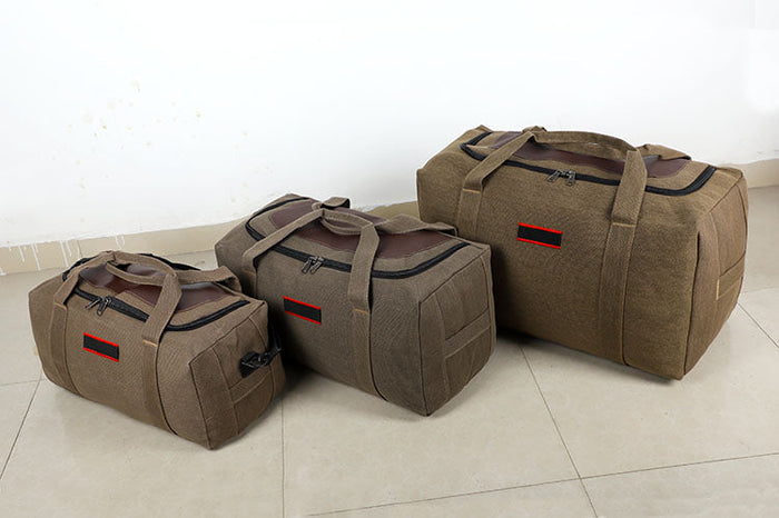 ECOTREK canvas storage bag with high capacity for travel, camping, and moving, shown filled with clothing and gear.