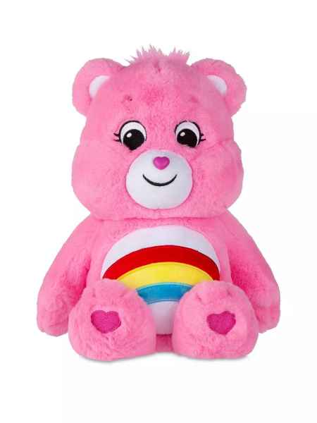 Pink fluffy bear plush with a rainbow on its white belly, a heart nose, and heart-shaped paw pads.