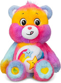 Multicolored tie-dye plush Care Bear with a belly badge featuring two smiling stars and a rainbow.