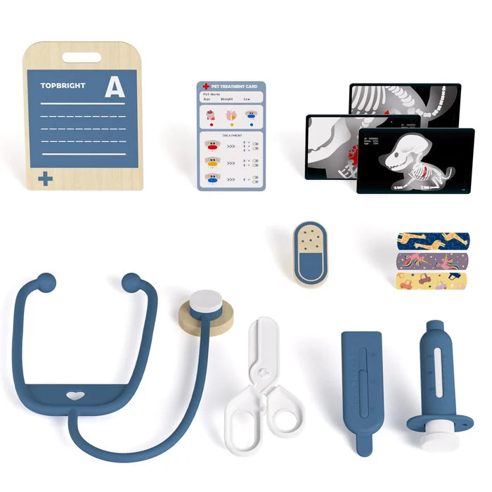 Toy pet vet kit with blue stethoscope, white scissors, syringe, thermometer, X-ray cards, and treatment form.