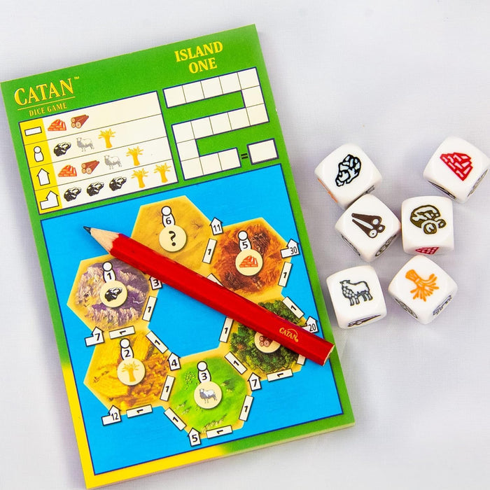 Green Catan scorepad with a red pencil and six white dice showing colored resource icons on a white background.