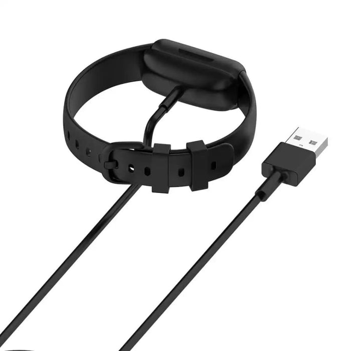 Fitbit Inspire 3 charger with USB cable connected, designed for easy charging of Fitbit Inspire 3 activity tracker.