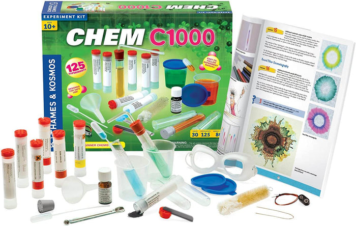 CHEM C1000 set with test tubes, lab gear, and an experiment manual displayed before its green and blue box.