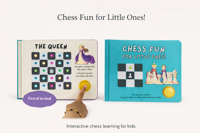 Teal interactive chess book with light-up move grids, cartoon characters, and a finger pressing a yellow button.