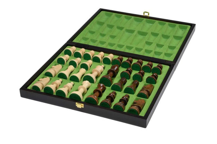 Open black wooden chess box with green felt molded slots holding natural and dark brown wooden pieces.