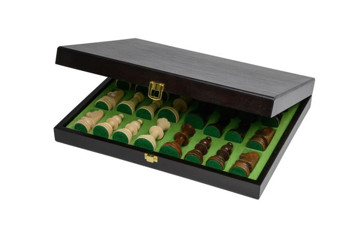 Open black wooden chess set box showing light and dark wood pieces in green felt compartments with a gold metal clasp.