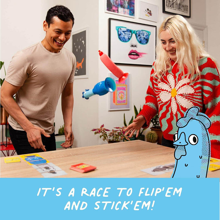 Two people race to flip and stick blue chicken and red hotdog toys with suction cups onto a table.