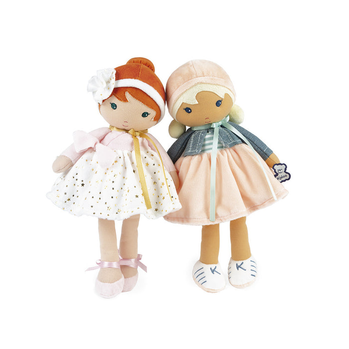 Two plush dolls: one with red hair in a white star dress, the other in a peach skirt and denim-style jacket.