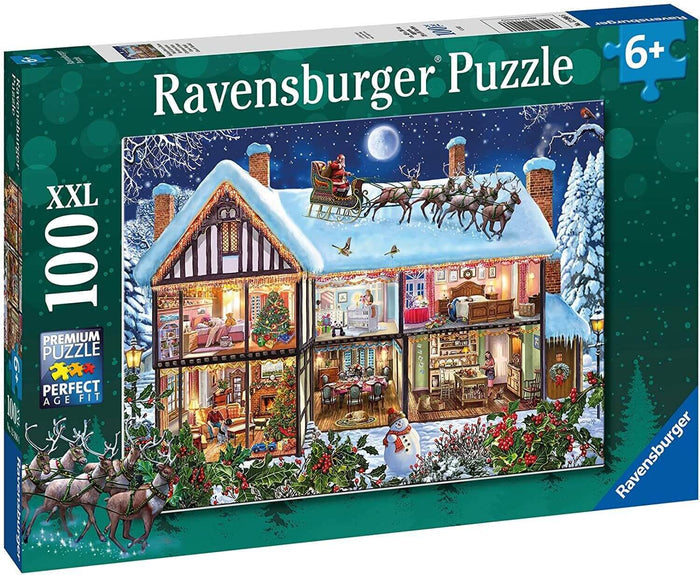 Green Ravensburger 100 XXL puzzle box showing a snowy house with a cutaway view and Santa flying past a full moon.