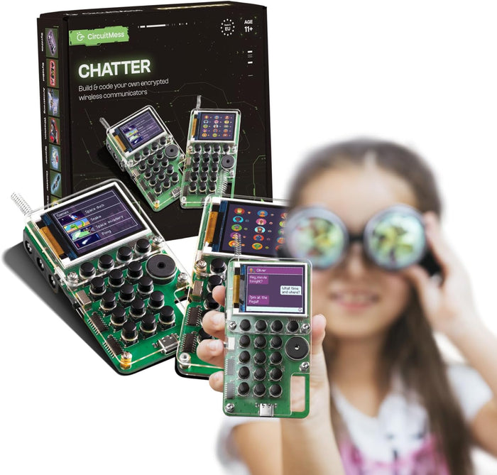 Black product box and DIY walkie-talkies with green circuit boards and black buttons; child in goggles holds one.