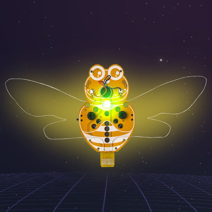 Yellow bee-shaped PCB toy with a glowing LED center and wire wings against a starry purple grid background.