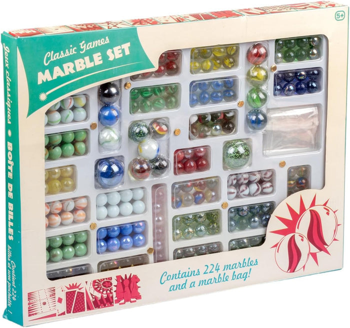 Boxed collection of assorted colorful glass marbles and a white storage bag displayed in a clear windowed tray.