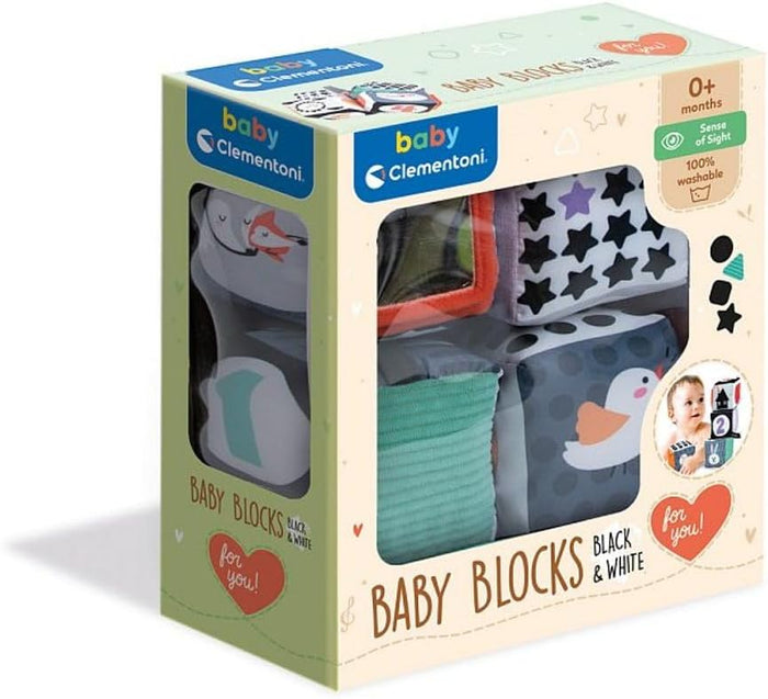 Soft baby blocks with black, white, and colorful patterns, stars, and animals in a 0+ month display box.