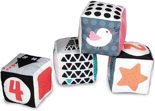 Four soft cube blocks with high-contrast black, white, and coral designs of a bird, star, house, and number 4.