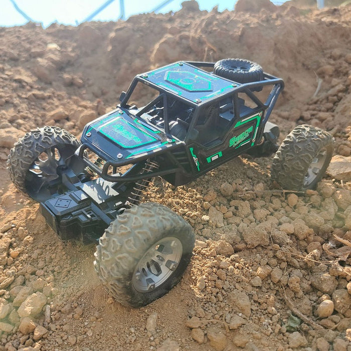 Green rechargeable off-road climbing RC car from dealonline.co.nz, shown on rugged terrain ready for outdoor adventures.