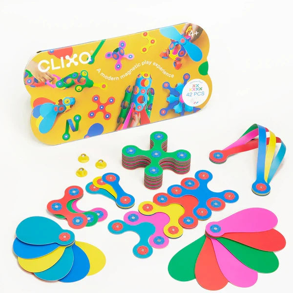 Colorful flexible magnetic building pieces in assorted rainbow shapes shown next to their illustrated yellow box.